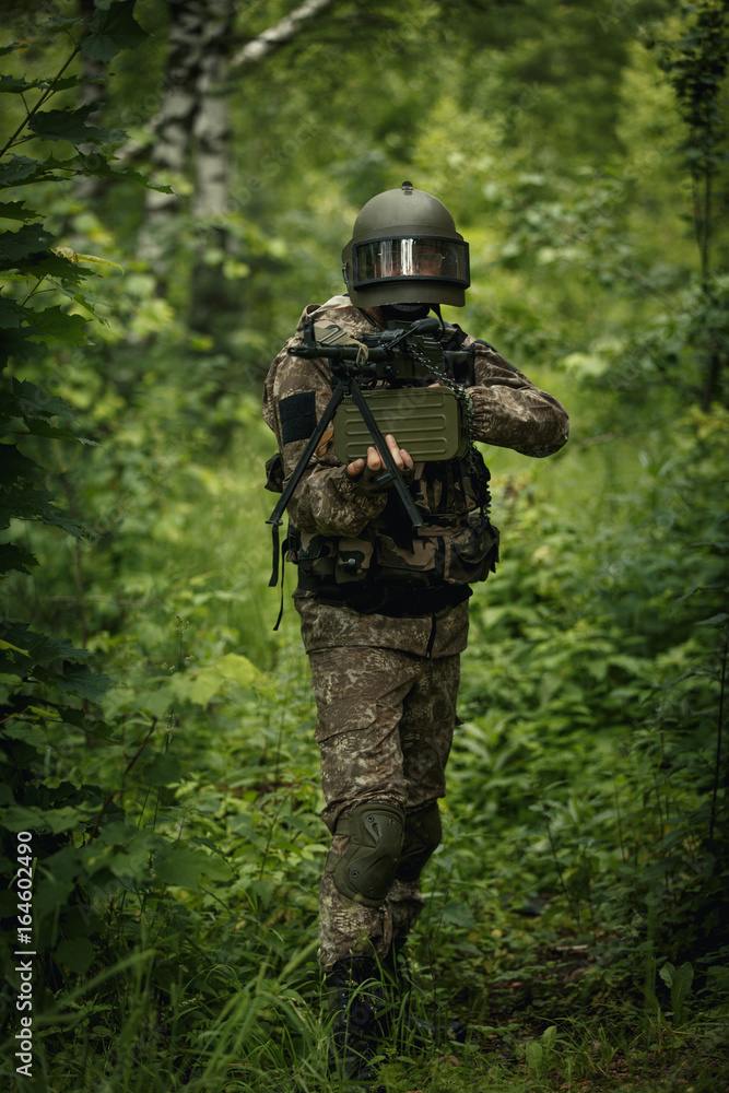 Military man with gun, helmet Military man with gun, helmet