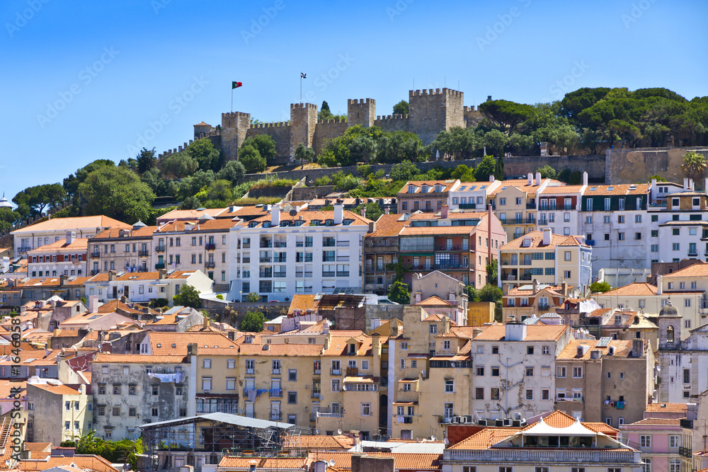 The visible profile of the Castle of Sao Jorge (Castelo de Sao Jorge) overlooking the historical centre of Lisbon city, Portugal
