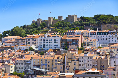 Fototapeta Naklejka Na Ścianę i Meble -  The visible profile of the Castle of Sao Jorge (Castelo de Sao Jorge) overlooking the historical centre of Lisbon city, Portugal