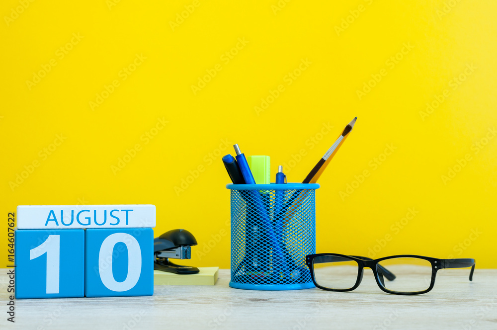 August 10th. Image of august 10, calendar on yellow background with office supplies. Summer time August 10th. Image of august 10, calendar on yellow background with office supplies. Summer time