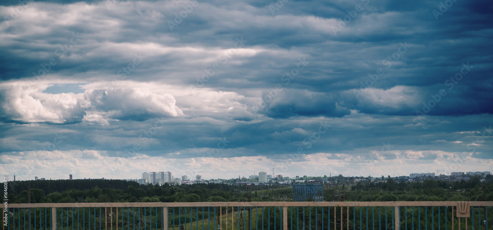 view of the city in bad weather. dark clouds in the sky view of the city in bad weather. dark clouds in the sky
