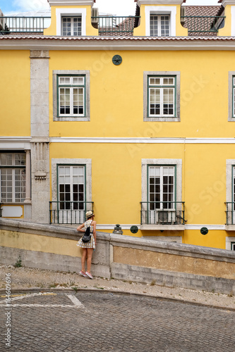 Chica mirando en una típica calle de Lisboa photo