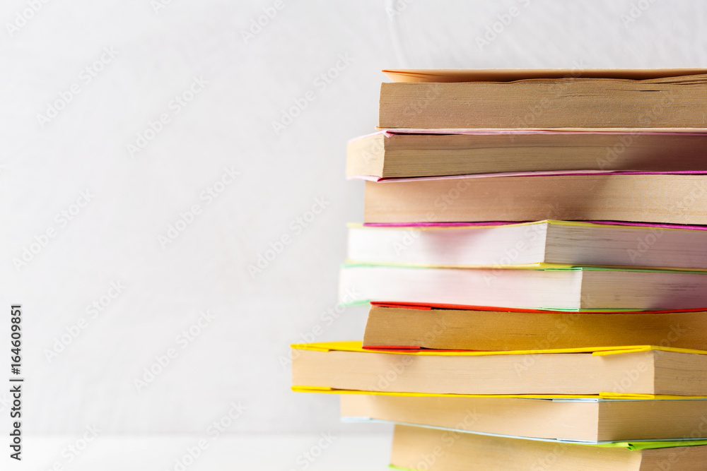 pile of paperback books on a table pile of paperback books on a table