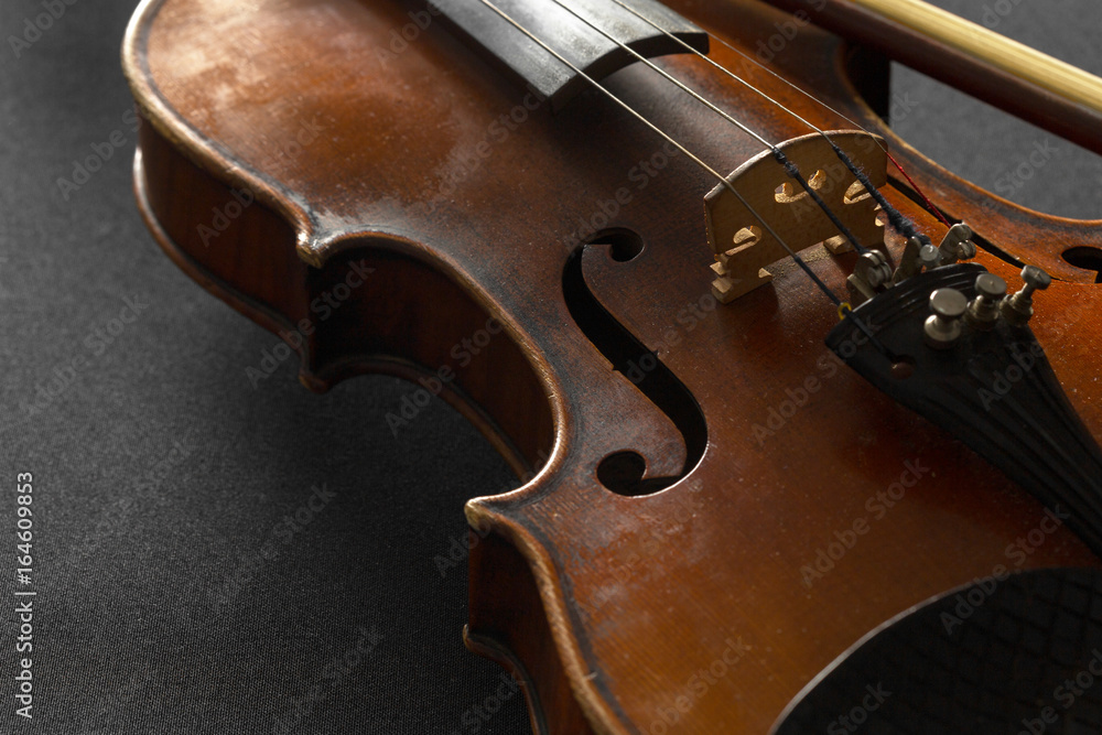 Fototapeta premium Old violin on a black background