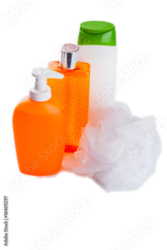 isolated  shampoo, shower gel, loofah on a white background