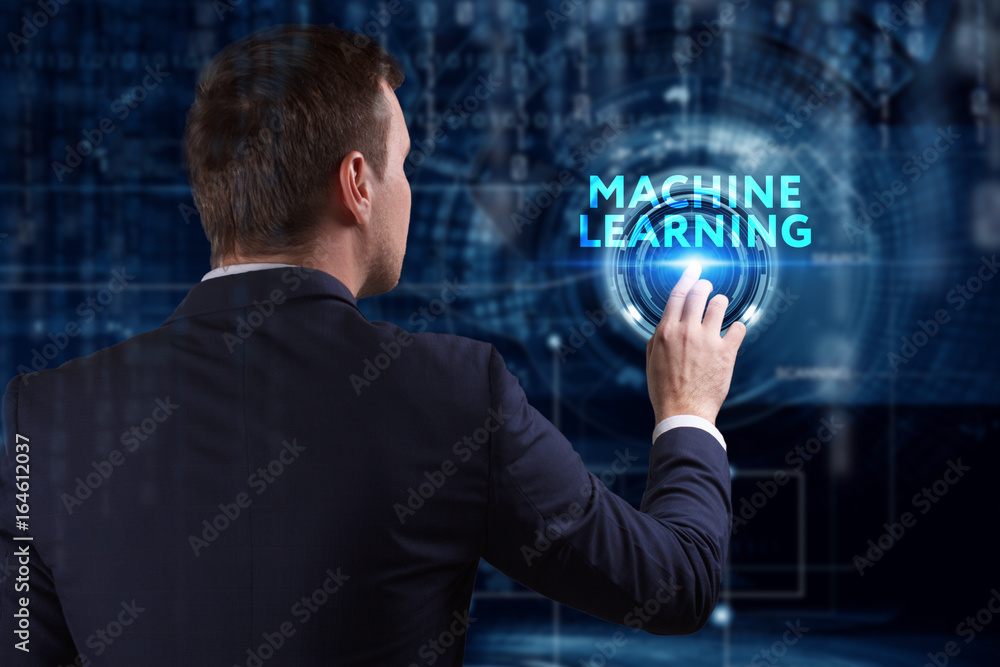 Business, Technology, Internet and network concept. Young businessman working on a virtual screen of the future and sees the inscription: Machine learning Business, Technology, Internet and network concept. Young businessman working on a virtual screen of the future and sees the inscription: Machine learning