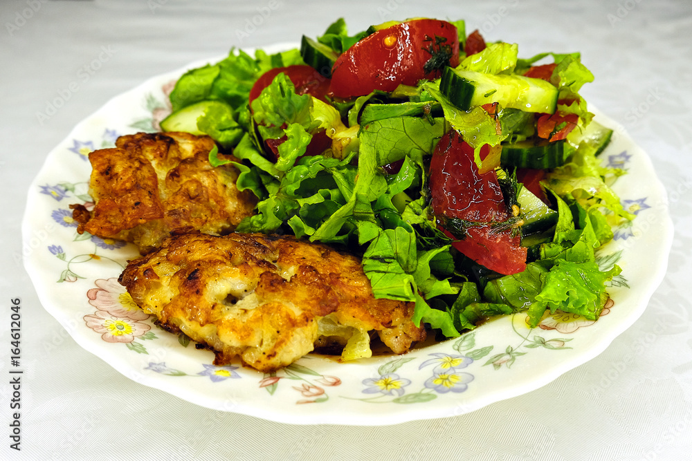 chicken cutlets with green salad and tomatoes chicken cutlets with green salad and tomatoes