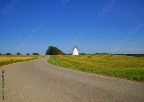 Beautiful, scenic, summer landscape. One windmill in field. Rural, countryside concept.