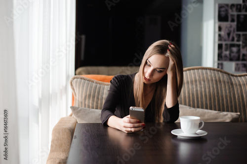 tired business woman working with mobile phone during a break