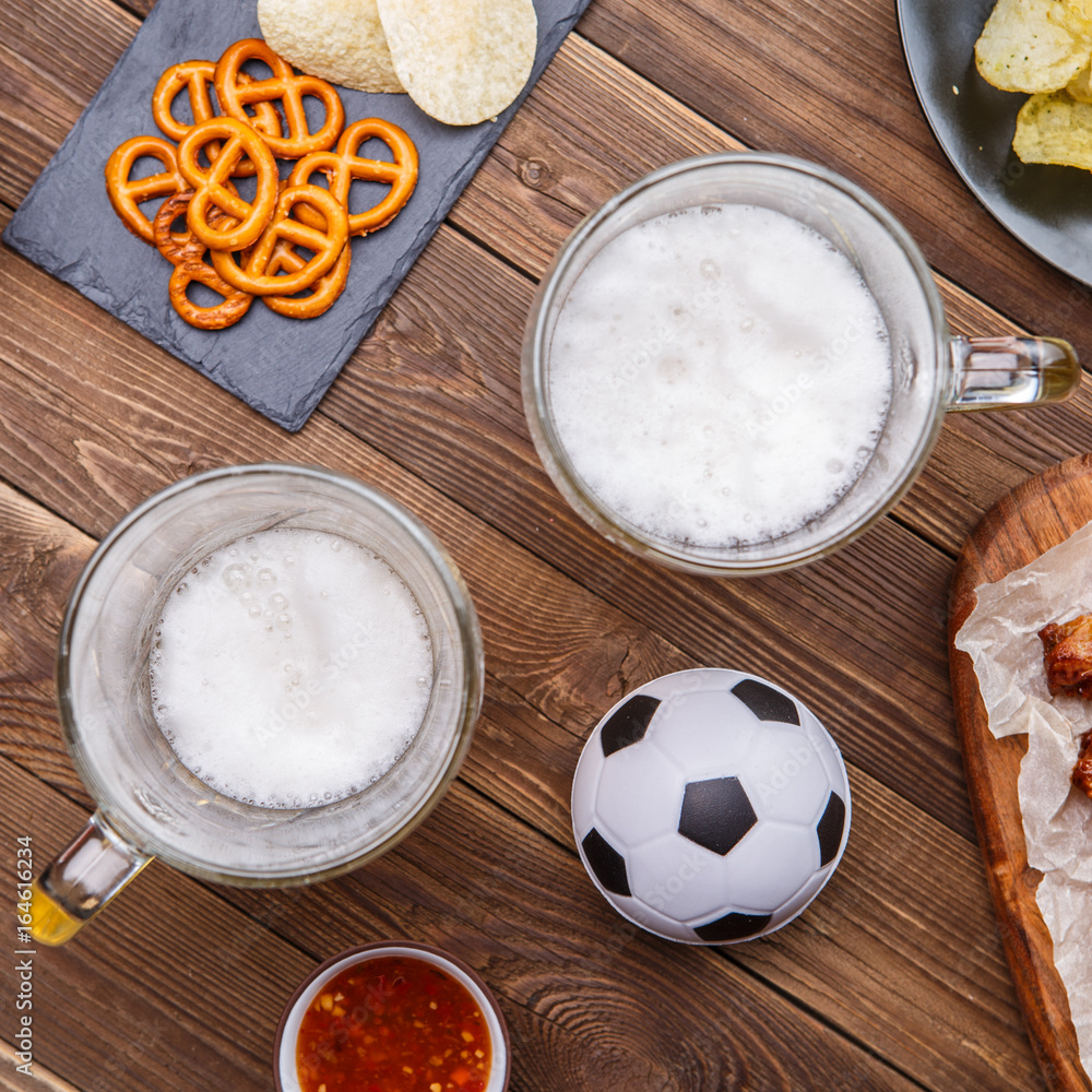 Appetizers and beer on the table for watch the football match. Appetizers and beer on the table for watch the football match.