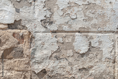 grey texture, old chipped plaster on the concrete wall, background