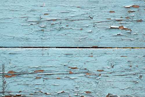 Obraz na płótnie Wooden bars, painted in blue color with cracked and peeling paint. w salonie