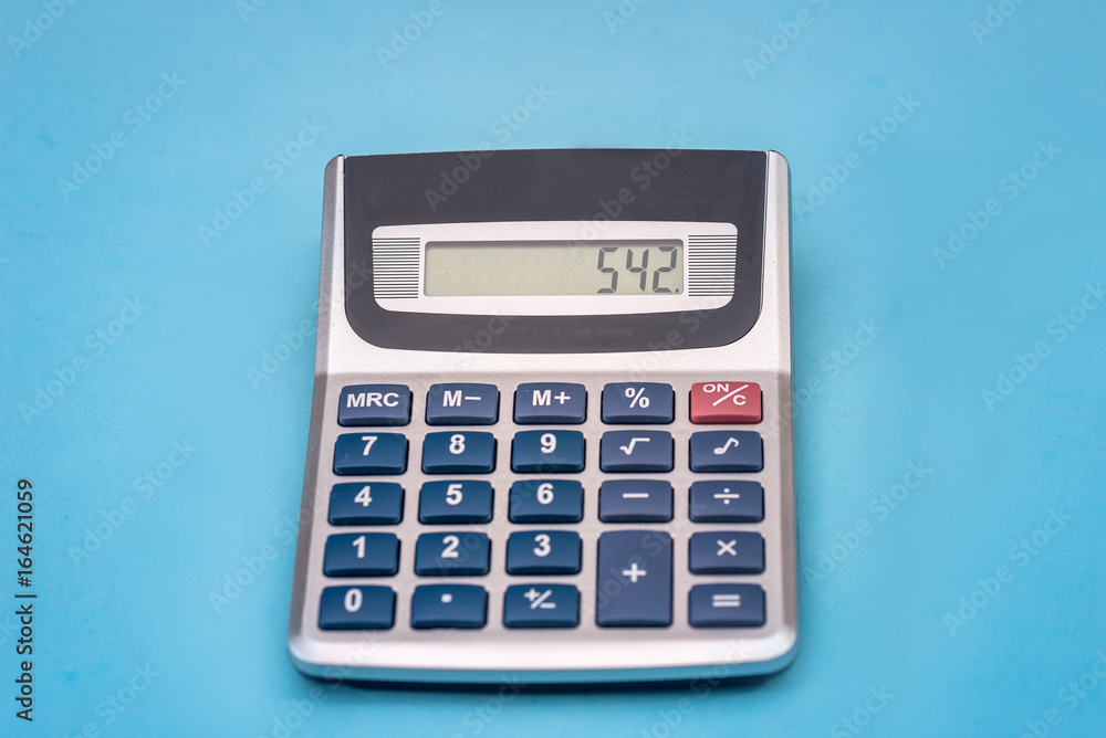 calculator isolated on blue background. close up calculator isolated on blue background. close up