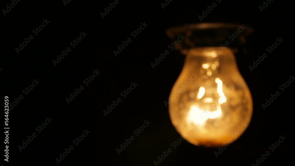 Electric light bulb on a black background Electric light bulb on a black background