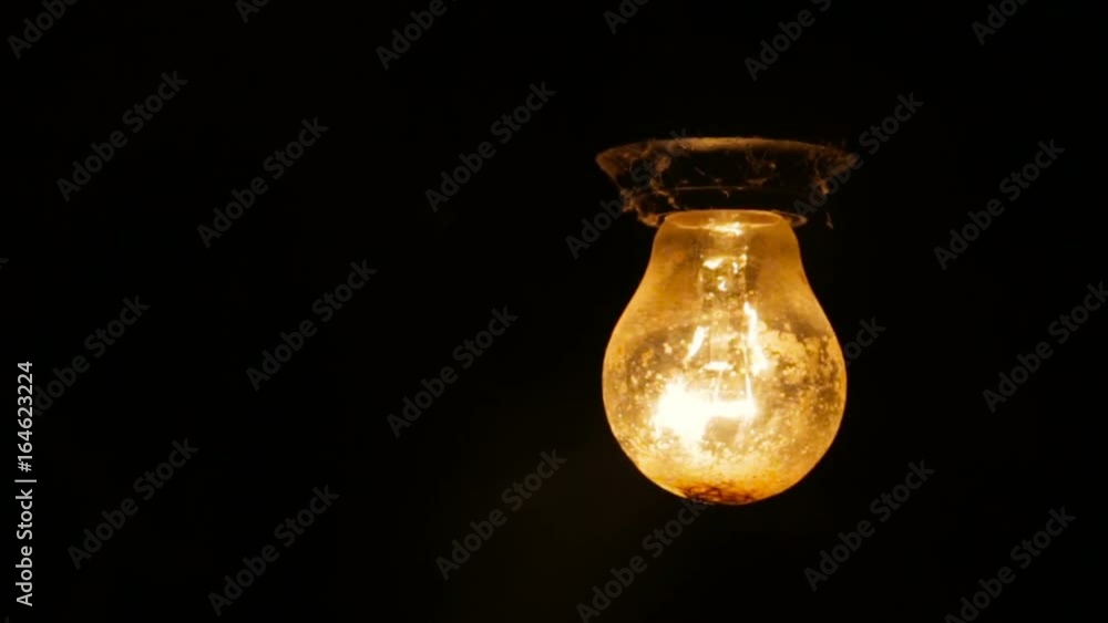 Electric light bulb on a black background Electric light bulb on a black background