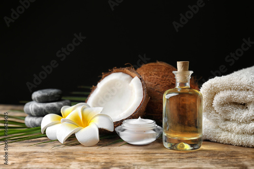 Set for spa treatment with coconut on wooden table