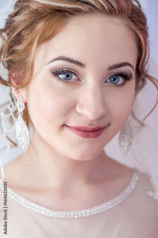 Beautiful bride. Wedding hairstyle and make up.