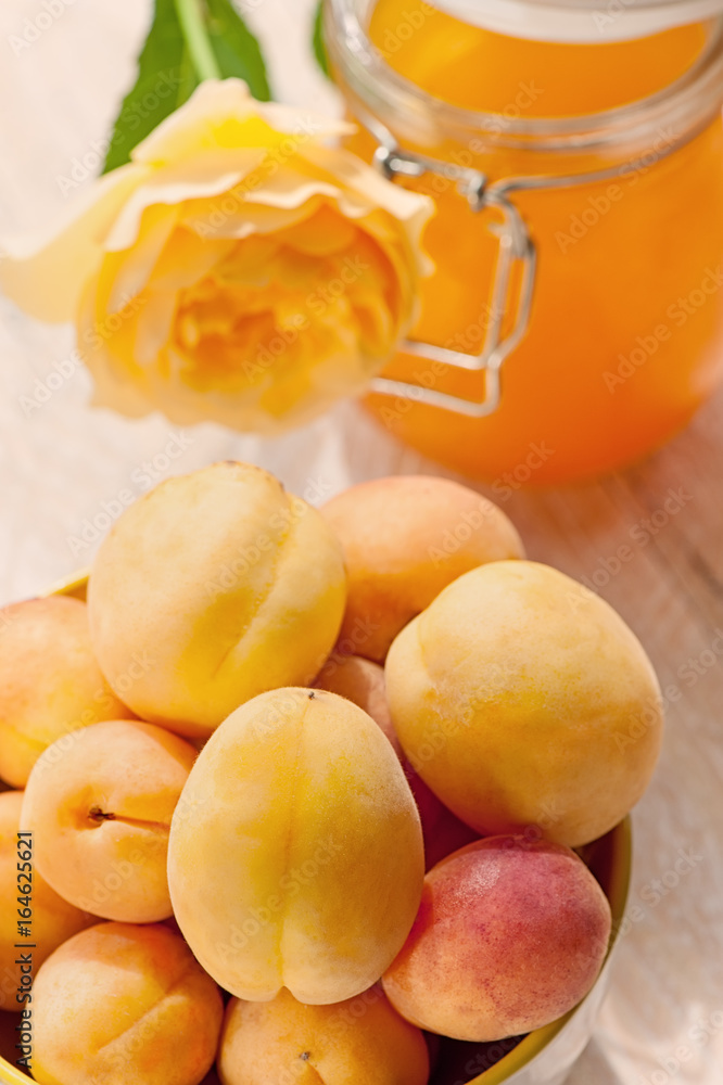 Ripe yellow apricots with apricot detox drink with juice. The green background. Ripe yellow apricots with apricot detox drink with juice. The green background.