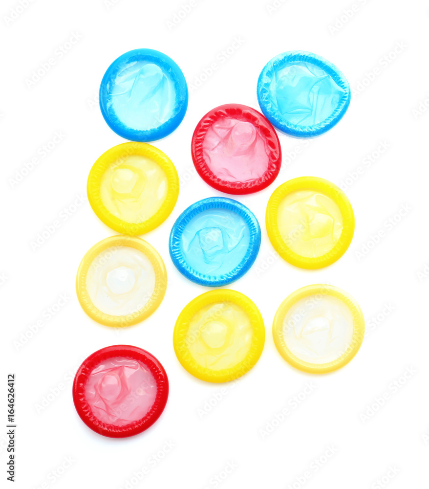 Colorful condoms on white background. Safe sex concept Colorful condoms on white background. Safe sex concept