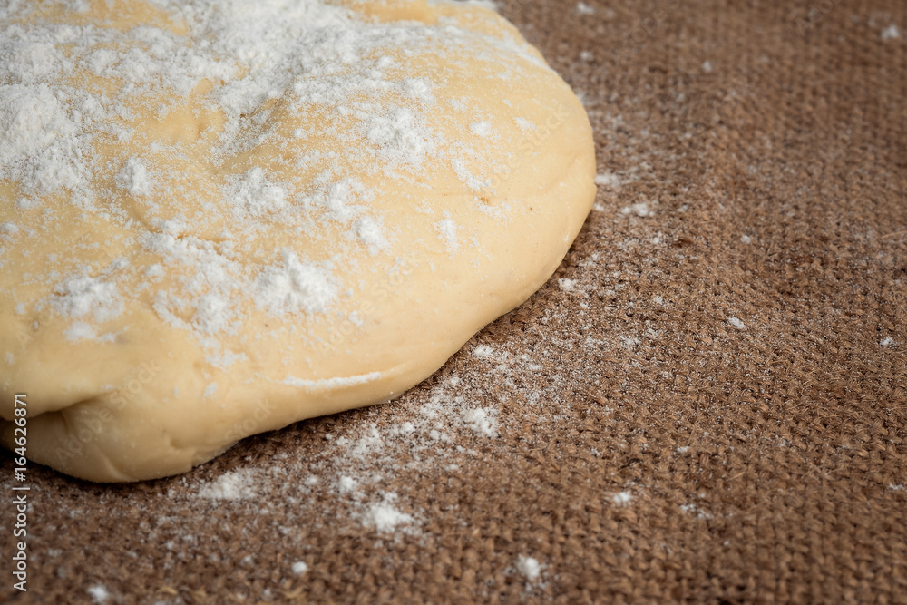 Ball of dough for pizza on the background of rustic Ball of dough for pizza on the background of rustic