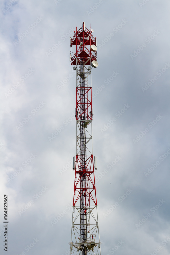 Telecommunication tower on the background of a cloudy sky Telecommunication tower on the background of a cloudy sky