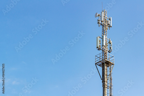 Telecommunication tower on a blue sky background with copyspace
