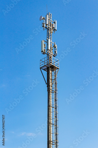 Telecommunication tower on a blue sky background