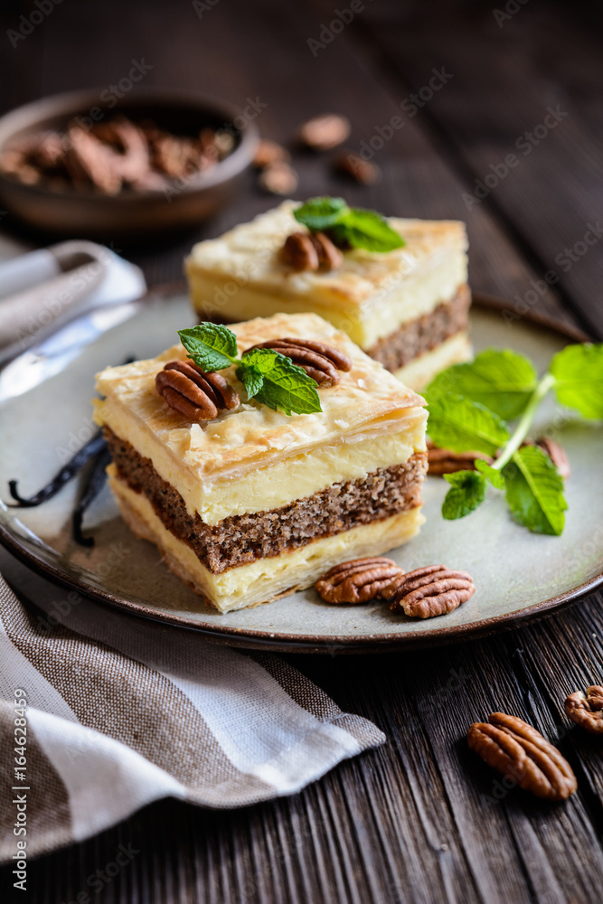 Delicious cremeschnitte with vanilla custard cream and pecan nut dough Delicious cremeschnitte with vanilla custard cream and pecan nut dough