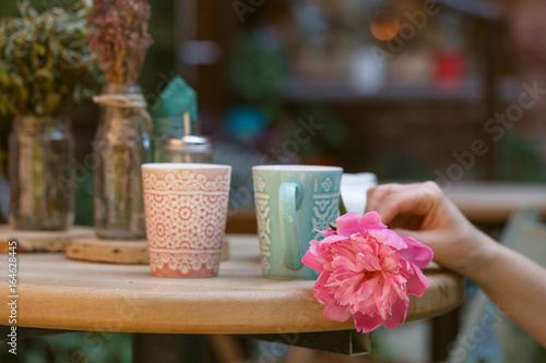 Wallpaper Mural woman are drinking tea in street cafe Torontodigital.ca