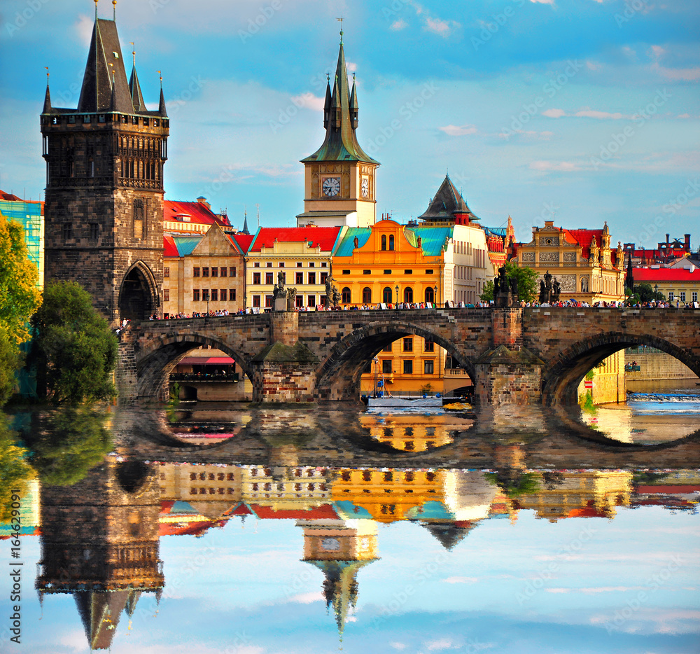  Charles bridge in Prague Czech Republic. Beautiful view of famous bridge, colorful architecture and Vltava river with reflection - obrazy, fototapety, plakaty 