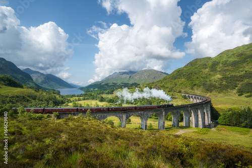 Jacobite steam train (a.k.a. Hogwarts Express) passes Glenfinnan viaduct photo
