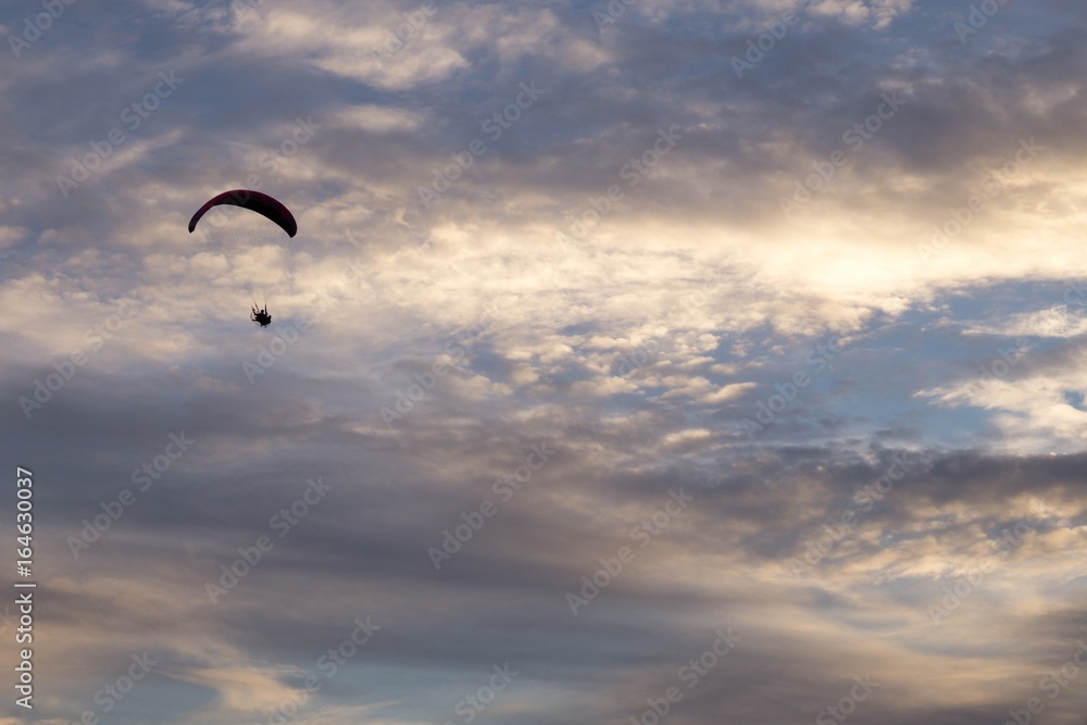 Paraglider flying in the air during colorful sunset. Slovakia Paraglider flying in the air during colorful sunset. Slovakia