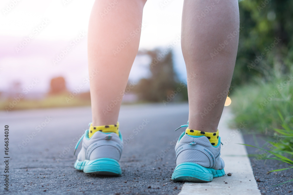 running on road closeup on shoe running on road closeup on shoe