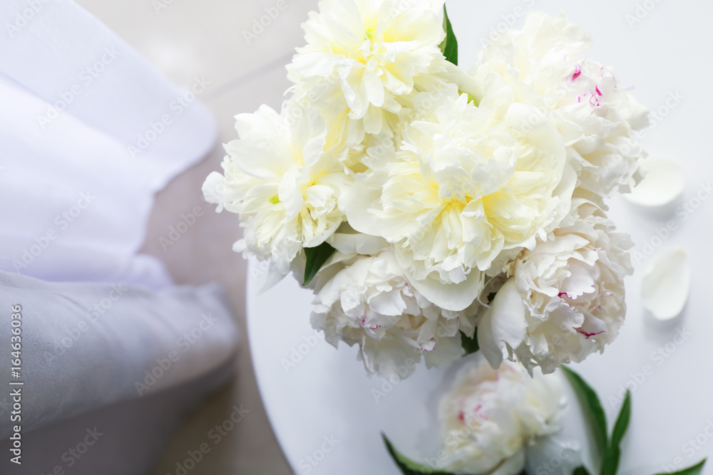 Top view of beautiful white peonies on table