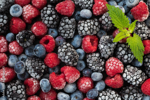Assorted frozen berries background. Top view of background