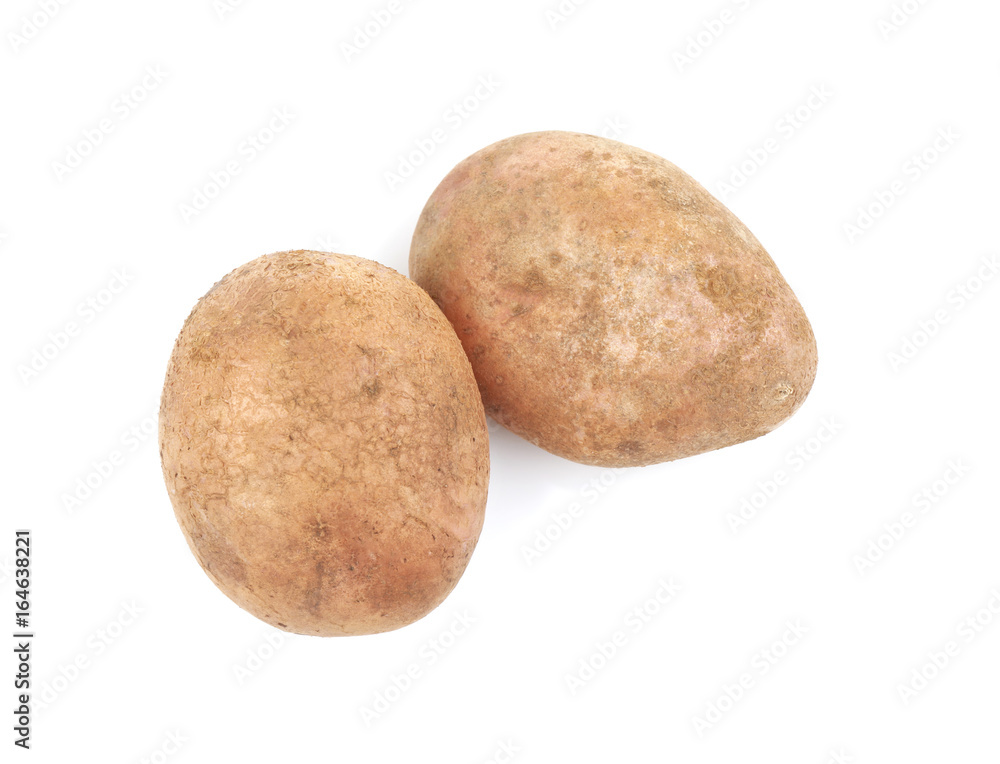 Raw unpeeled potatoes on white background Raw unpeeled potatoes on white background