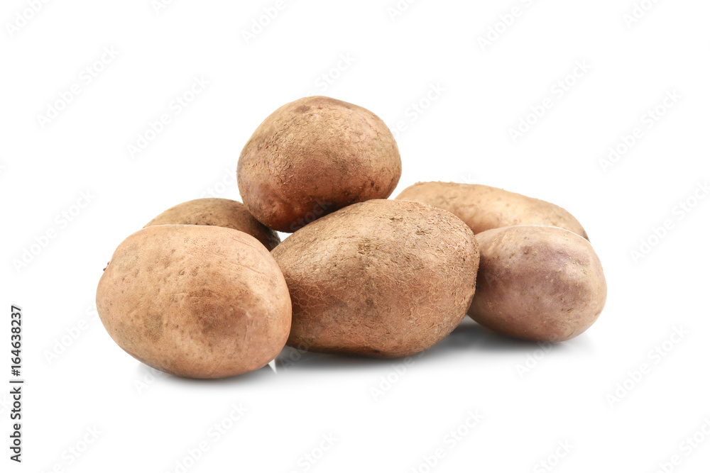 Raw unpeeled potatoes on white background Raw unpeeled potatoes on white background