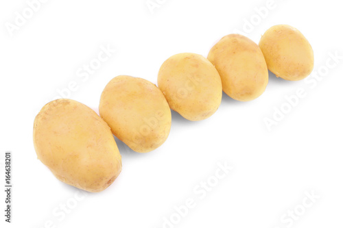 Raw unpeeled potatoes on white background