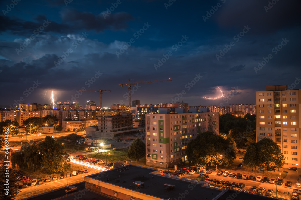 Lightnings Over Housing Estate. Night Storm in the City.