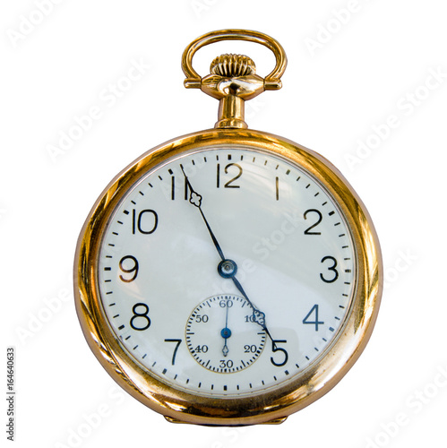 Isolated vintage gold pocket watch showing 9 o'clock. 