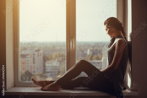 Girl resting and thinking at home