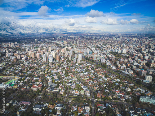 Aerial drone shot of Santiago de Chile at winter. Snowy cityscape of the city