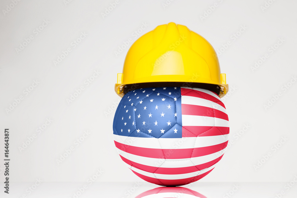 Obraz na plátně football wearing a yellow hard hat