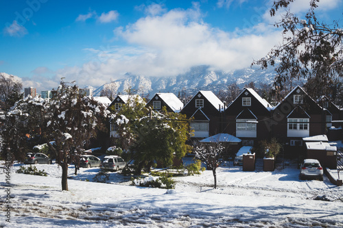 Snowy houses in the city. Santiago de Chile at winter