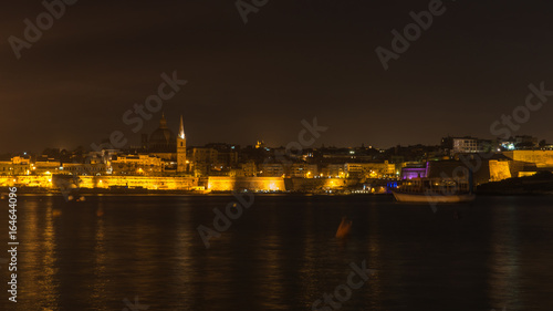 Night cityscape of Valletta seen from Sliema waterfront, Malta