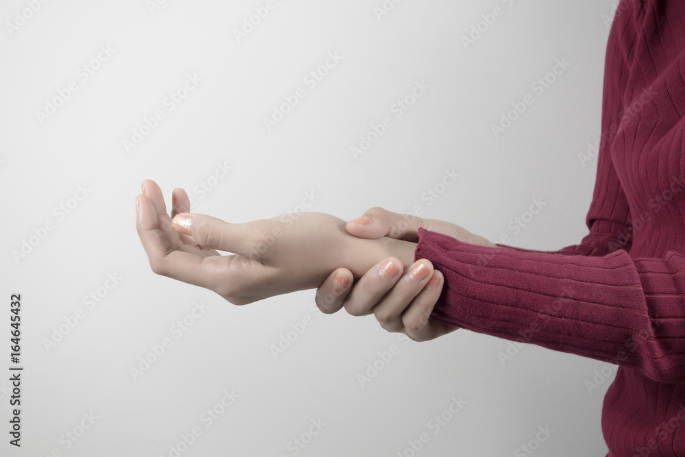 Fototapeta premium Young woman holding her wrist pain