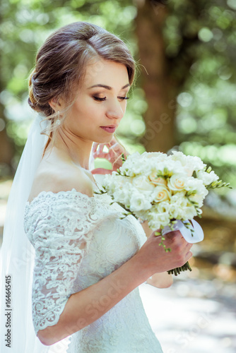 Bouquet in bride's hands photo