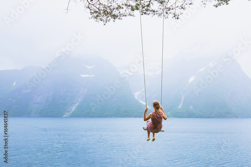 romantic beautiful girl on swing in Norway, happy dreamer, inspiration background