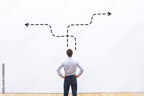 business strategy or decision making concept,  pensive businessman choosing direction