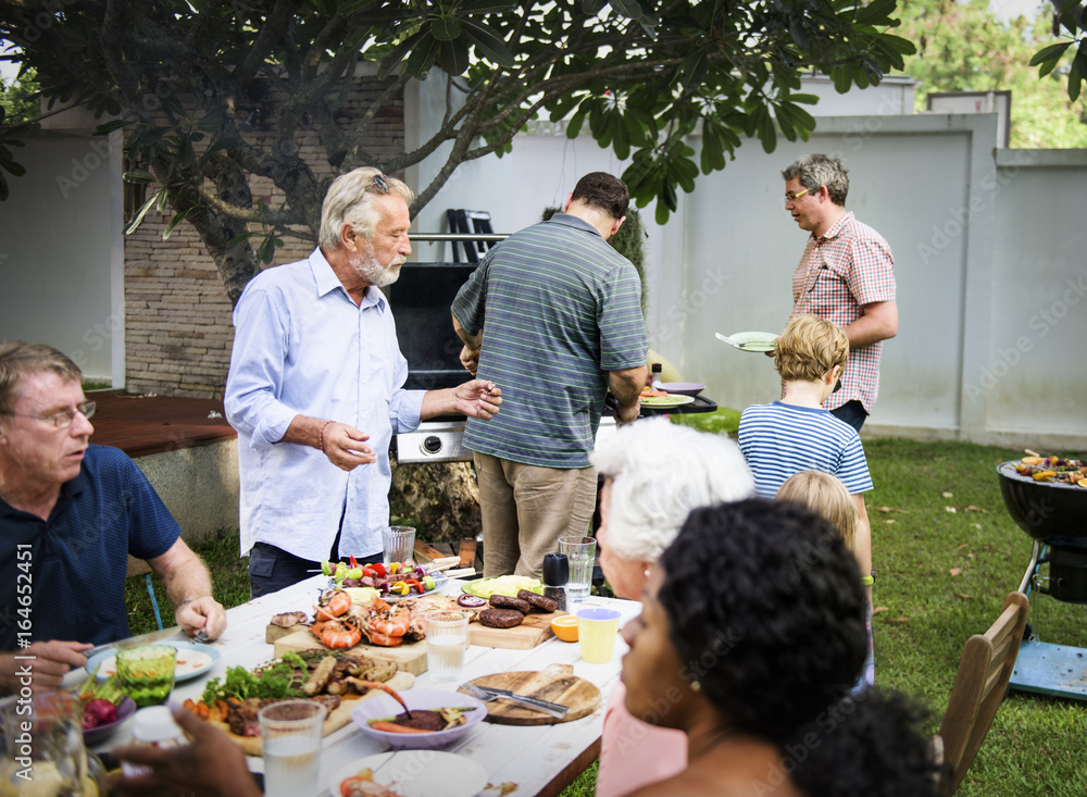 Group of diverse people enjoying barbecue party together